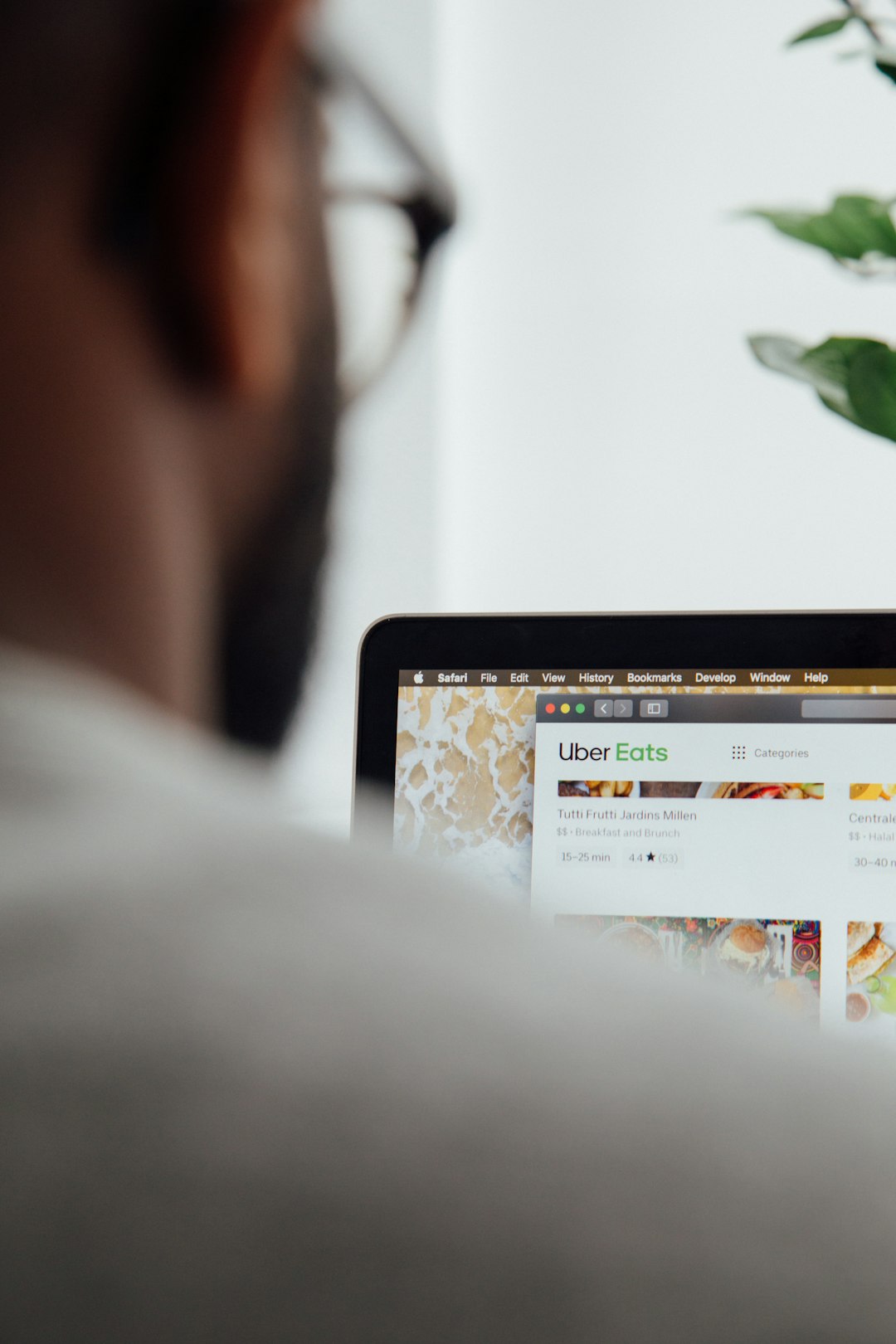 Home a-man-looking-at-a-website-on-his-laptop-kyh-0gfrgna